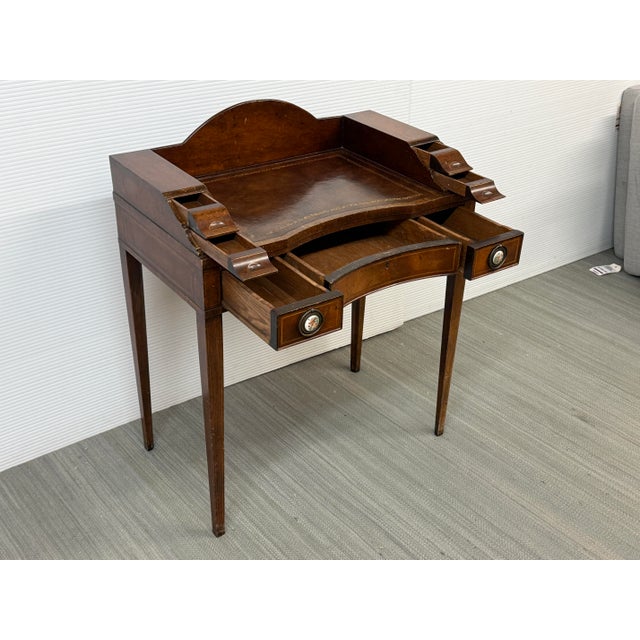 Design Plus Gallery presents an Early 20th Century Ladies Writing Desk. The desk is made with multi-toned finish with...