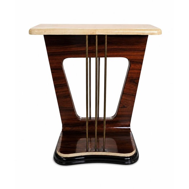 An elegant Art Deco-style console table characterized by sinuous lines and refined proportions. The frame is crafted from...