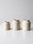This set of three antique stoneware crocks dates to the early 20th century and features creamy ivory glaze, rounded...