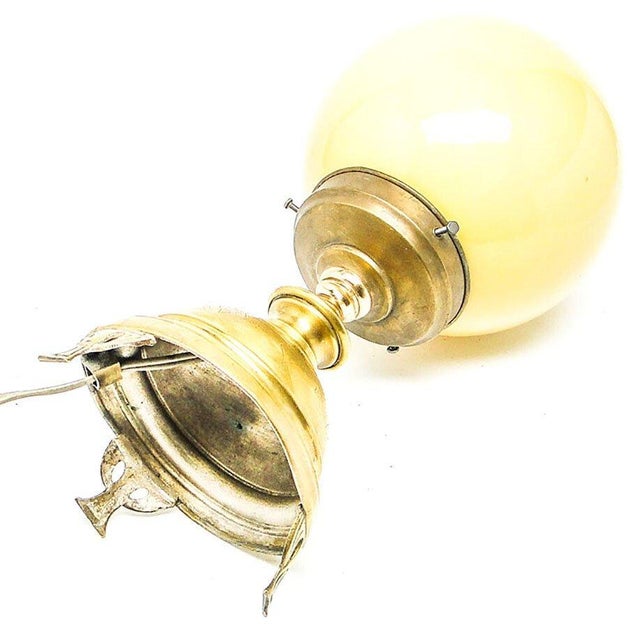 Table lamp made in Germany in the 50s. Lamp construction made of metal, and spherical lampshade of glass. It is preserved...