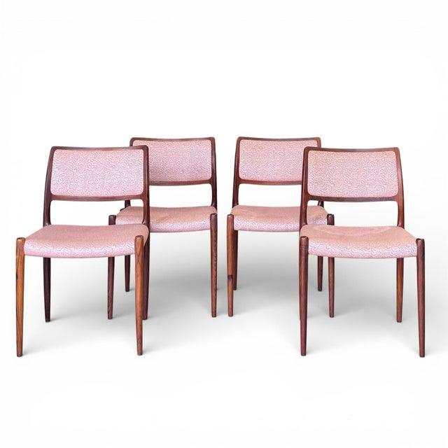 A sophisticated set of six Danish Modern dining chairs designed by Niels O. Møller for J.L. Møllers Møbelfabrik,...