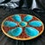 This stunning 19th-century S. Fielding & Co. Majolica Oyster Plate features six vibrant turquoise-blue oyster wells...