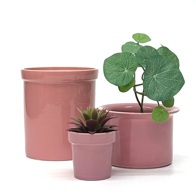 Rose pink ceramic planters, group of 3. This is a gorgeous set of blush and mauve pink ceramic planters from the mid 20th...