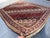 A captivating antique Caucasian Shirvan tribal rug in the classic all-over blossom lattice format — the entire field is...
