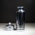 ABOUT Art Deco chromed copper cocktail shaker with black enamel bands and Bakelite collar. Cap lifts to reveal a...
