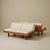 Pair of rare two-seater sofas, model “L09E,” by Pierre Chapo, designed circa 1960 as a banquette-style sofa in solid elm...