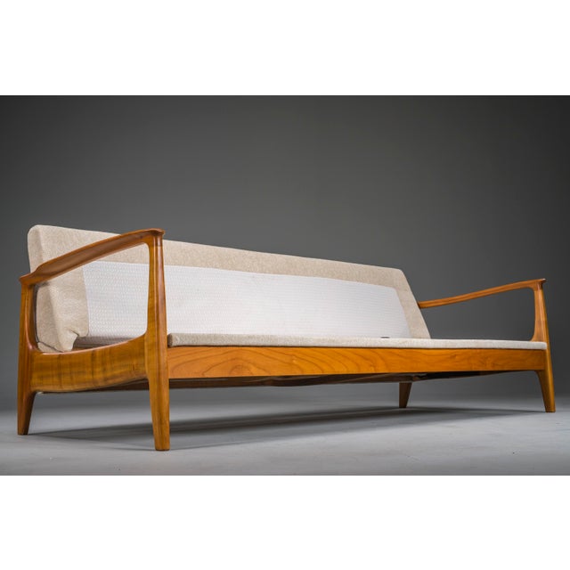 Mid-century danish sofa and pair of armchairs designed by eugen schmidt for soloform, 1960s. The set has been...