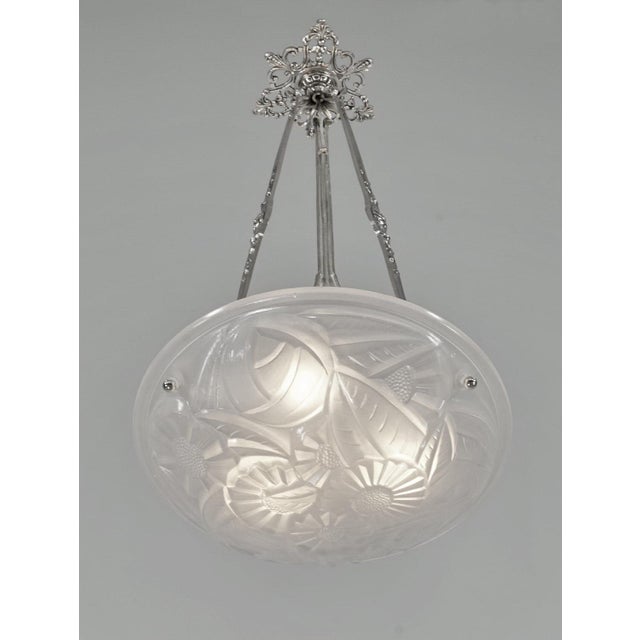 Degué A signed French art deco pendant around 1930 in nickel plated bronze or solid brass holding a beautiful shade by...