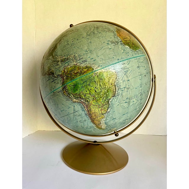 Here is a wonderful, vintage fully rotating 12" globe by Replogle. The globe dates to the 1960-70's and features raised...