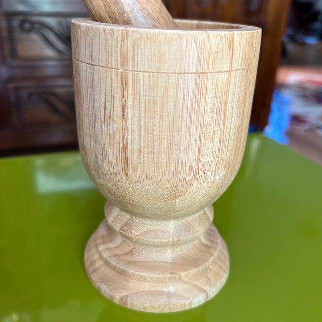 Uncover the enduring charm of the handcrafted vintage Wooden Mortar and Pestle. For centuries, artisans have used this...