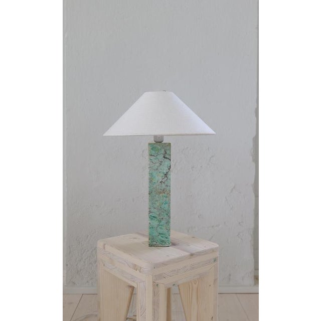 This marble table lamp was produced by bergboms lamp factory in sweden. This one with a rare green marble with exceptional...
