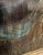 A moody and evocative mid-century modern abstract landscape oil painting on paper, rendered in a rich, atmospheric palette...