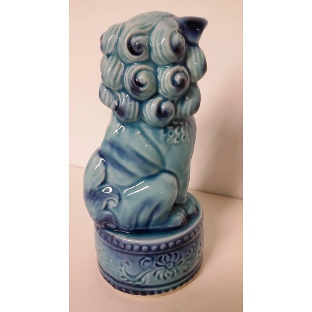 Vintage Antique Chinese Foo Dog sitting on a round stand. This Dog is highly collectible. Just try to find a round stand...