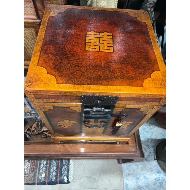 An unusual and very unique lightweight wood Chinese wedding cabinet. Includes the original Chinese lock and key. This is a...