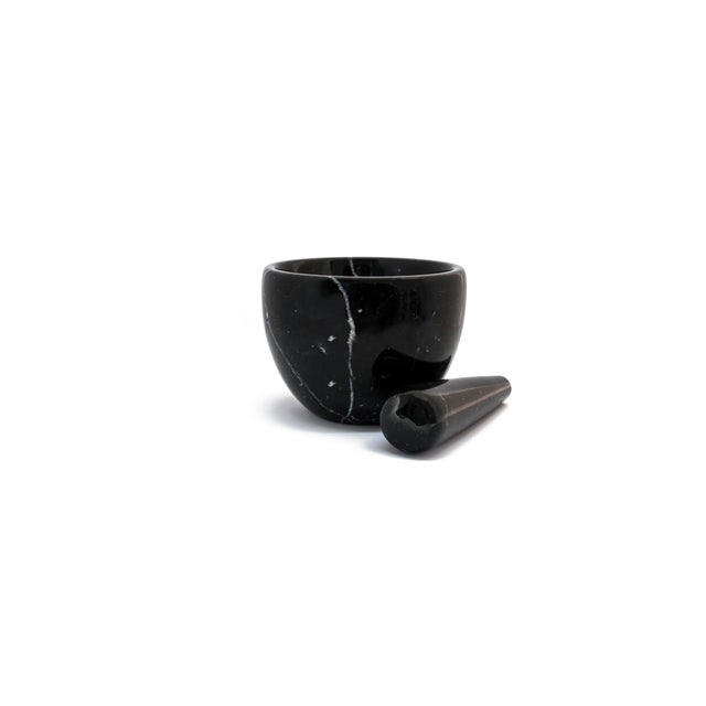 Small black Marquina marble mortar and pestle. Size of the mortar: diameter 12 cm x height 9; size pf the pestle: diameter...