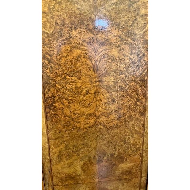 Beautiful Vintage Art Deco Burl Wood Armoire in excellent condition. There are three doors and two compartments. The left...