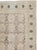 This mid-20th-century Persian Kashan carpet presents a refined allover lattice composition across a soft ivory and pale...