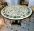 Grand French-Style Round Dining Table – Ornate Marble Top With Gilded Columns & Black Base For Sale - Image 4 of 4