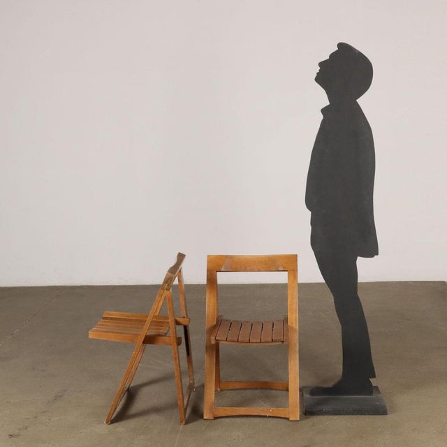 Pair of folding chairs made of wood. This piece is attributed to the mentioned designer/maker. It has no attribution mark...