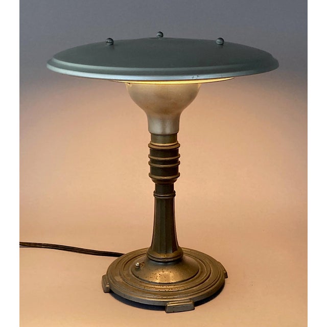 I've never seen one of these amazingly sleek, downright sculptural, iconic American desk/table lamps in this color...