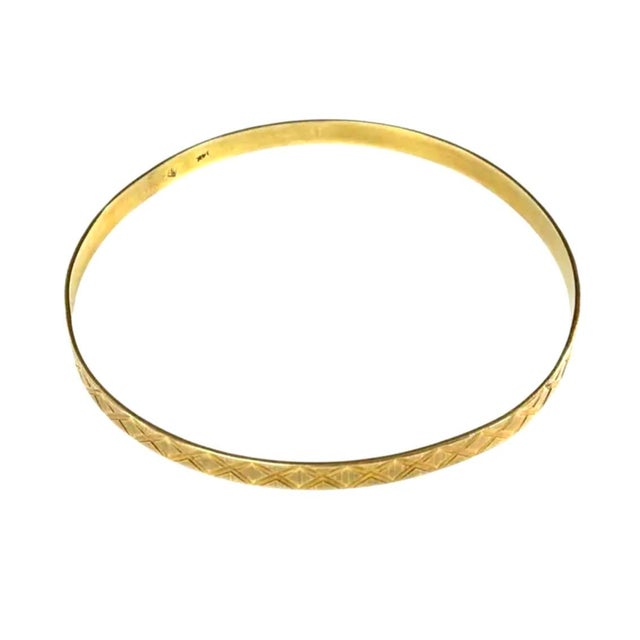 14K Yellow Gold Vintage Bangle Bracelet. Bracelet is elegant in its simplicity and embodies the timeless appeal of...