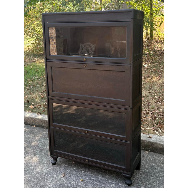 Love this antique barrister lawyers bookcase! Three sections with glass doors and one section makes into a Secretary desk...