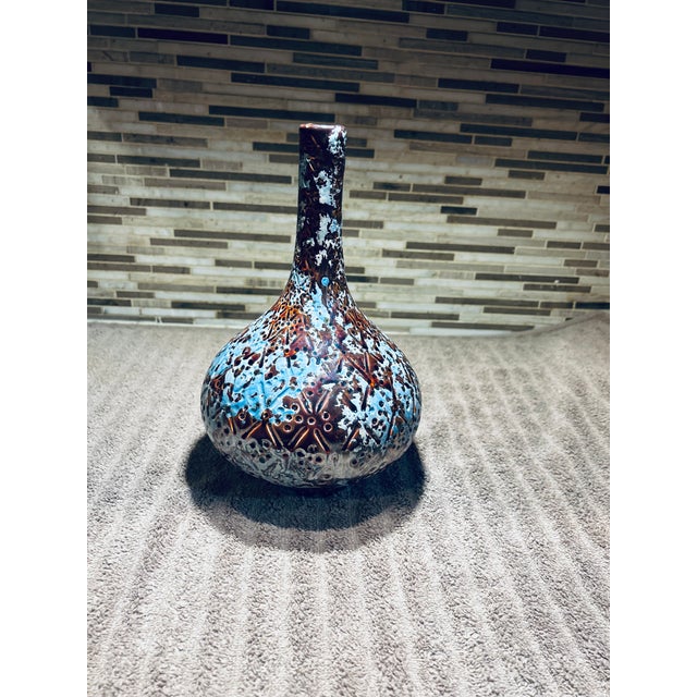 This sculptural mid‑century European art pottery vase features a dramatic volcanic glaze in teal‑blue and chocolate brown...