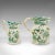 This is an antique set of table pouring jugs. An English, ceramic gravy, white sauce, custard and cream jug, dating to the...