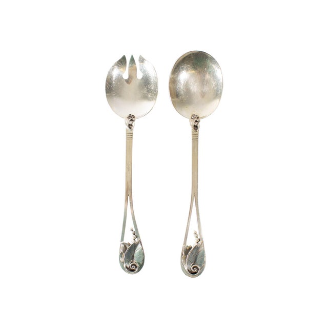 A pair of serving utensils with design by the Italian-American silversmith Alphonse La Paglia (1907-1953) and produced by...