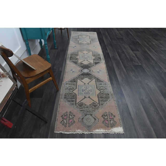 Vintage Hand-Knotted area rug is a semi-antique vintage area rug. The '70s Eastern region of Anatolia's unique rug is...
