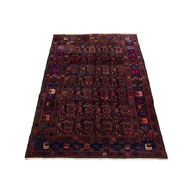 This stunning rug sports a dark-brown field, complemented by multicolor accents, seamlessly merged to create an all-over...