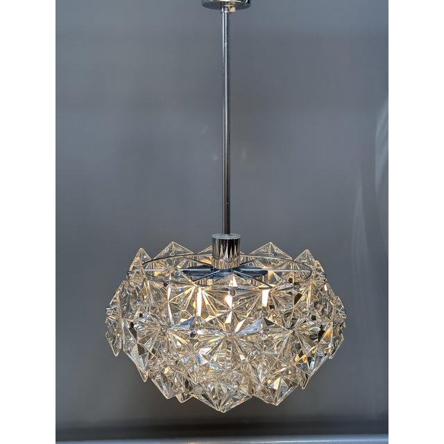 A beautiful and highly decorative three-piece lighting set by kinkeldey, germany, the 1970s, comprising a sculptural...