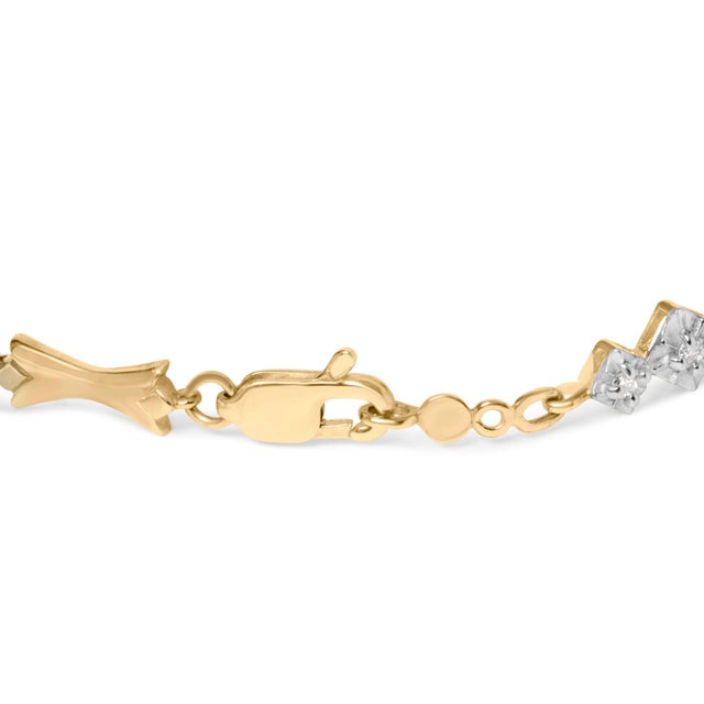 Step into a world of divine elegance with this exquisite two-tone gold diamond bracelet. Crafted with 10K gold, this piece...