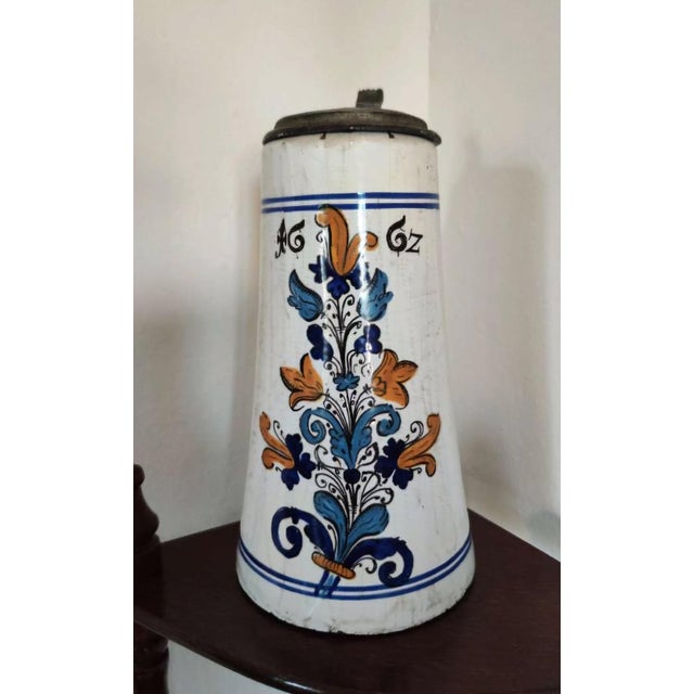 Extremely rare Slovak Haban faience tankard (Walzenkrug), dated 1662. Hand-painted with a bold floral bouquet in cobalt...