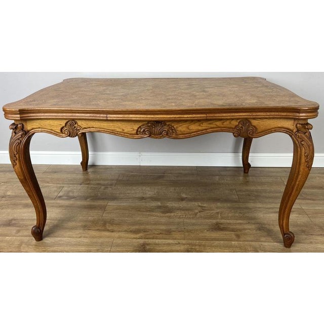 Enhance your dining space with this elegant Vintage French Louis dining table, beautifully crafted in oak and showcasing a...