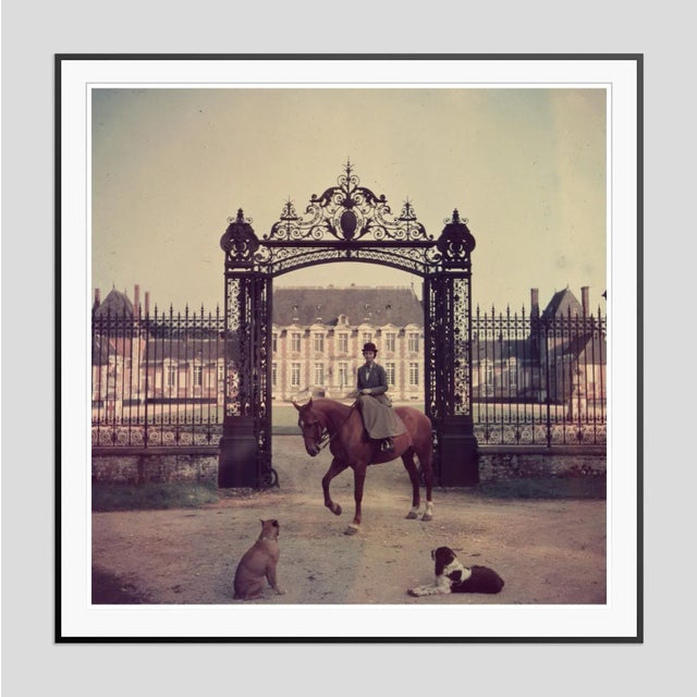 Equestrian Entrance' by Slim Aarons Open Edition 1957: Madame de la Haye-Jousselin on her horse at the gates to her...