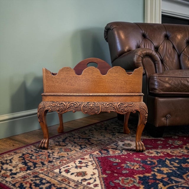 A finely crafted Baker Furniture Canterbury side table featuring a removable handled caddy, carved claw feet, and richly...