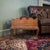 A finely crafted Baker Furniture Canterbury side table featuring a removable handled caddy, carved claw feet, and richly...