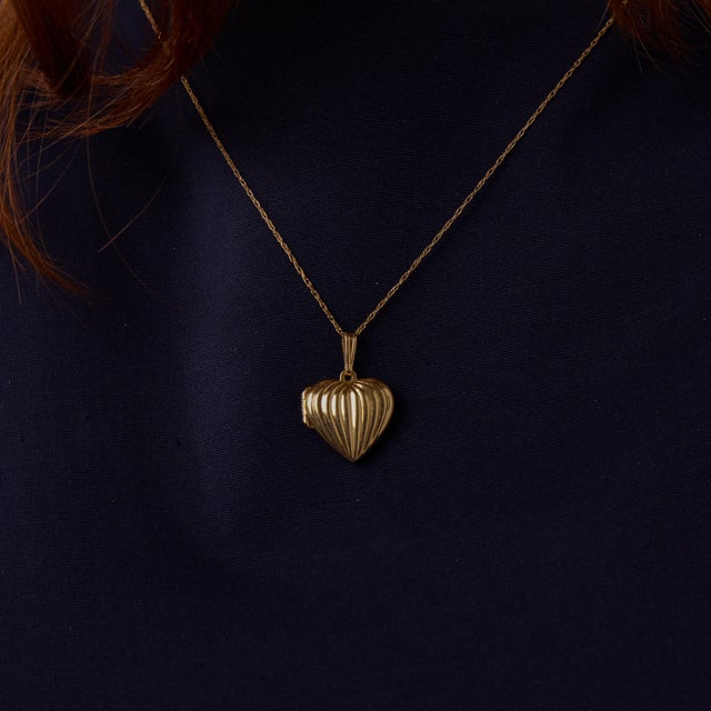 This charming vintage heart locket necklace is a lovely 1970’s piece, crafted in warm 14k yellow gold with a timeless and...