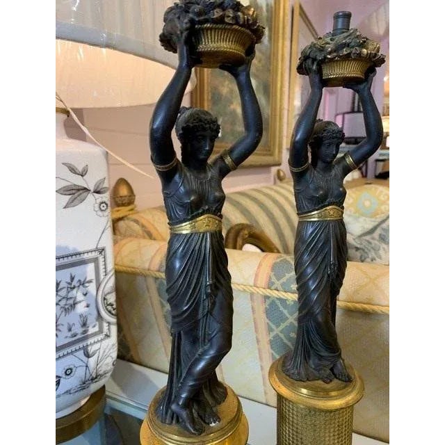 Pair of bronze statues. Previously used, possibly as candelabras. In great condition. Sold ONLY as a pair.
