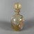 Highly prized decorative Murano glass bottle with submerged gold leaf and polychrome murrine. Subject and Style: Refined...