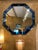 The blue octagonal wall mirror is designed by Bunny Williams. It measures 38" x 38". This unique mirror features a non-...