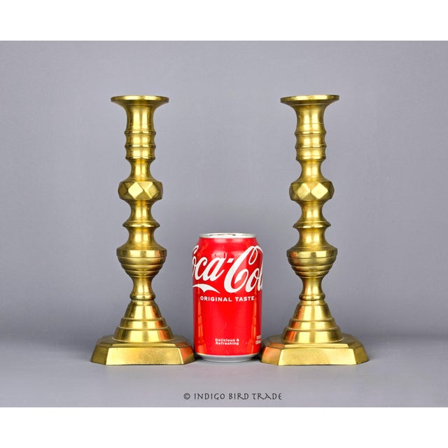 Rare Pair of 1830s English Beehive Brass Candlestick Holders. These elegant candlesticks showcase the distinctive beehive...