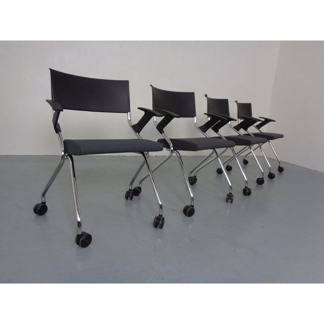 Set of 4 rolling meeting armchairs, model Flip Flap, by Sedus Stoll, 2014. The seats can be folded up, allowing the chairs...