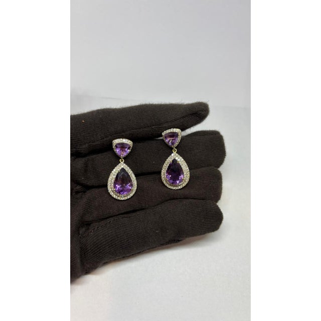Gemstone details Diamond weight: 1.71 cts Amethyst weight: 8.68 cts 14K gold Gross weight: 7.99 grams Gold weight: 5.32...