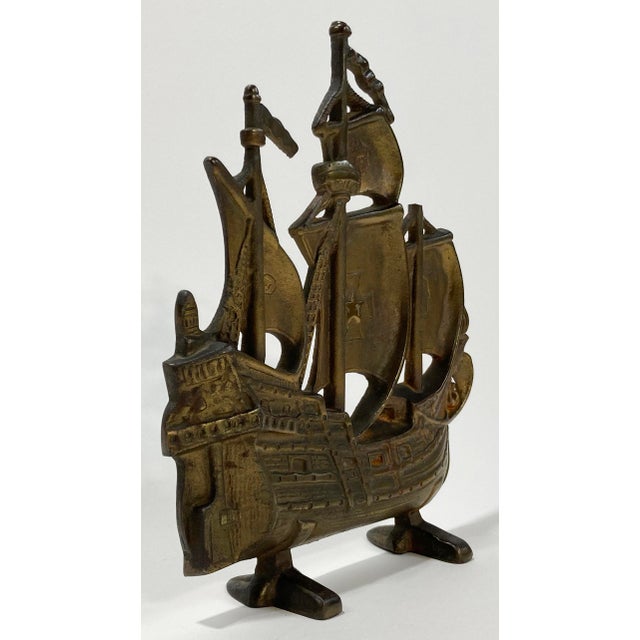 Vintage cast iron ship motif doorstop. Substantial in size with great detail. Footed for strong stability. Age wear. Patina.