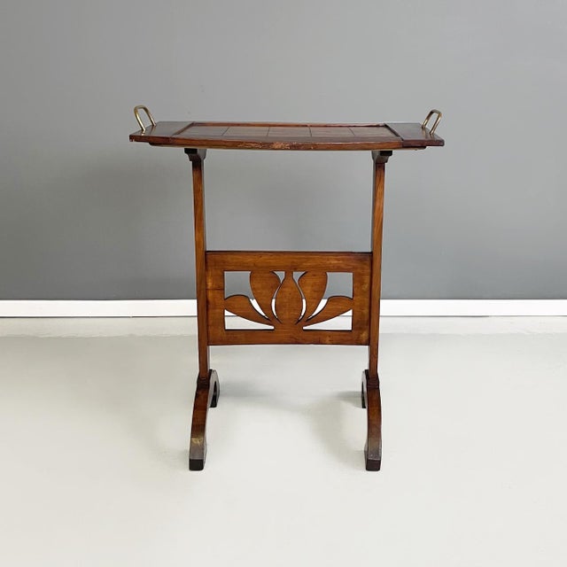 Italian antique Coffe or side table in wood and brass, 1900s Work table in solid wood and brass. The top has a square...