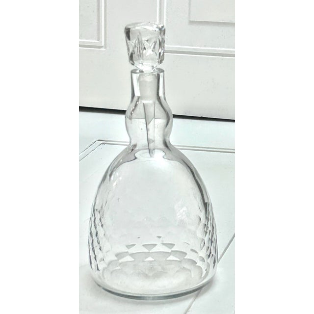 This is a Baccarat Crystal "Ecaille" model decanter, which is sometimes referred to as the "Honeycomb" cut pattern.Design...