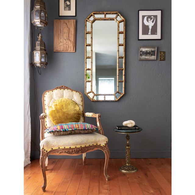 This tall chinoiserie vintage mirror features a faux tortoiseshell finish on a faux bamboo frame. The octagon shape and...