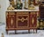 Elevate your home with this magnificent French Louis XVI-inspired sideboard, masterfully crafted from fine wood and...